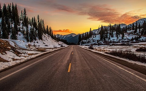 Road through snowy mountains.
