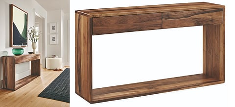 Graft console table in reclaimed walnut displayed against a neutral wall
