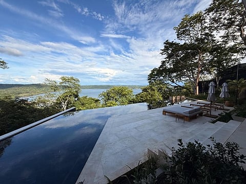 Infinity pool overlooking water.