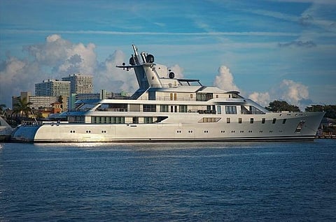 Large white luxury yacht on the water.