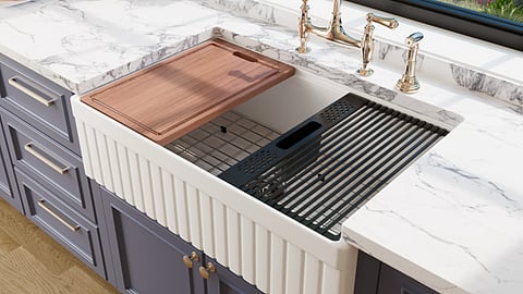 White fluted farmhouse kitchen sink.