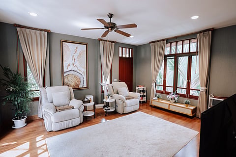Living room with two white recliners.