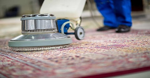 Carpet cleaning machine on a rug.