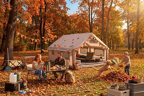 Family camping in an autumn forest.