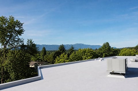 HVAC unit on a white roof.