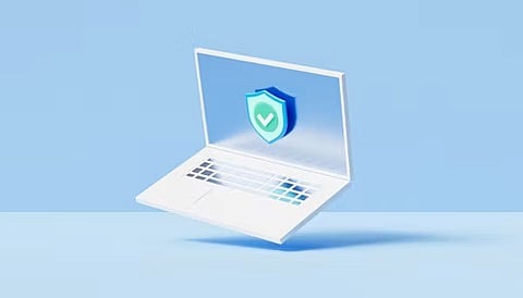 Laptop displaying a security shield icon.