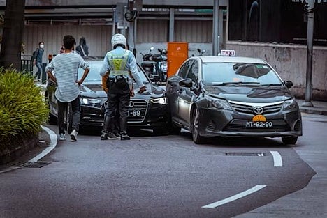 Police officer at a car accident scene.