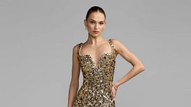 Woman in a gold sequin gown.