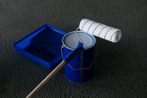 Paint roller, paint can, and tray.
