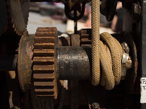 Close-up of a rusty rope winch.