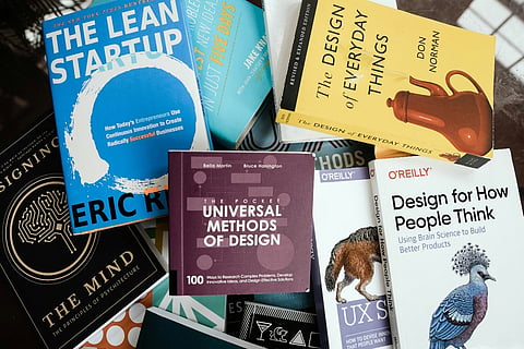 Pile of design and business books