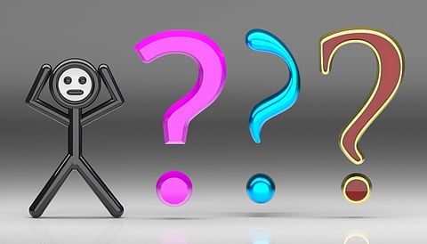 Stick figure with colorful question marks.