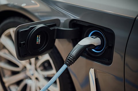 Electric car plugged into a charger.