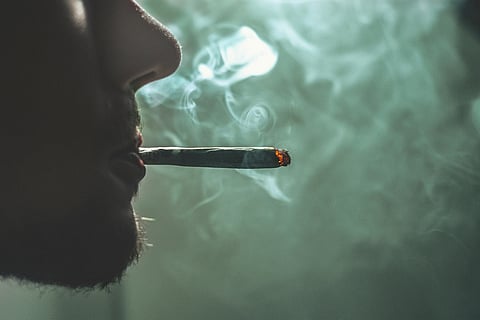 Close-up of a man smoking.