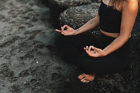 Person meditating.