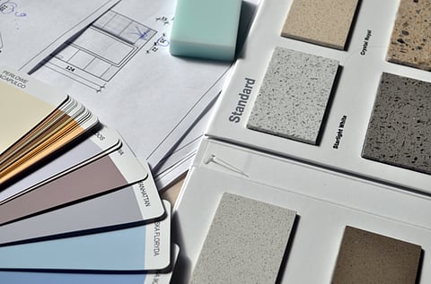 Color swatches and material samples on blueprints.   