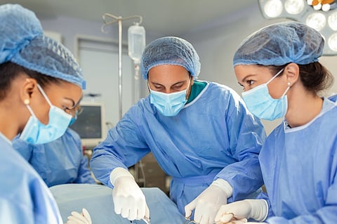 Surgeons operating.