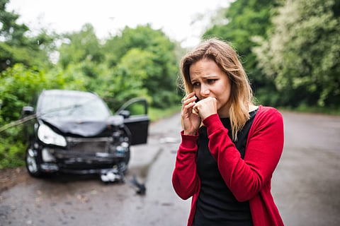 Distressed woman calling after a car accident.