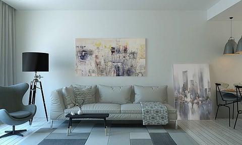 Modern living room with a sofa and artwork.