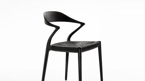 Rimadesio Ori chair in dark ash with a curved wooden back and woven seat