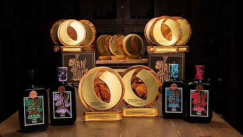 Pons Jan Rōc olive oil bottles displayed with awards.