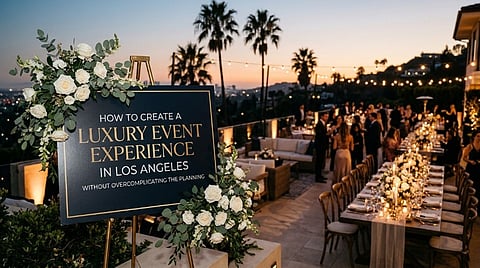 Floral event welcome sign overlooking an outdoor dinner party.
