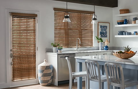 Kitchen featuring wooden window and door blinds.
