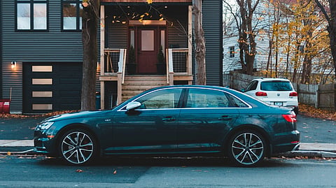Car parked in front of a house.