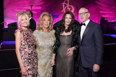 Four guests in evening wear pose together at the Angel Ball at Cipriani Wall Street