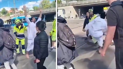 Video: Muslim lägger sig på vägen – släpas bort av byggarbetare