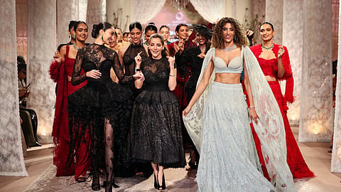 Designer Isha Jajodia at India Couture Week 2026 with the models.
