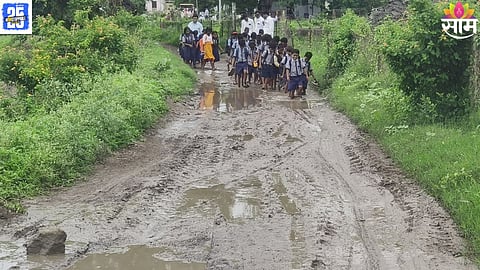 Children wade through mud and fields to reach school in Dahgaon village, Chandwad Taluka — a reality despite decades of independence and development promises.