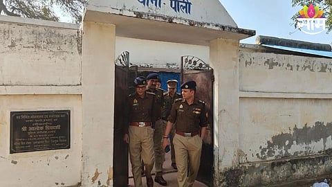 Police personnel investigate the crime scene at Hardoi Police Station after a woman was shot dead by her husband.