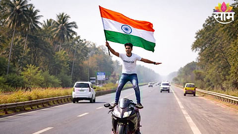 A youth performing a bike stunt with the Indian tricolour on Republic Day in Nashik district.
