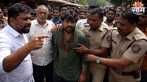 Residents and BJP leaders handing over the suspect to police after the superstition-based attack in Vita town.