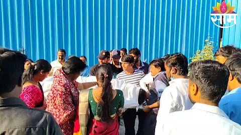 Relatives carry the body of a young man after a stretcher broke while taking the body for postmortem at Solapur Civil Hospital.