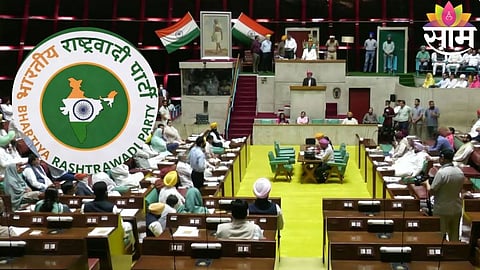 Navjot Singh Kaur unveils the new Indian Nationalist Party logo during the announcement.