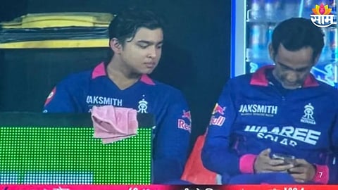 Rajasthan Royals manager faces BCCI action after being spotted using a mobile phone in the dugout during an IPL 2026 match.