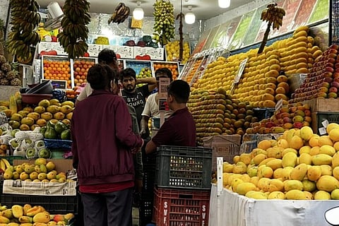 Trader selling mangoes 