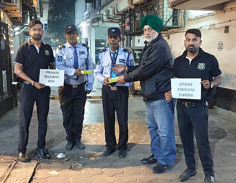 Members of KRG and CAPSI honouring the security guard