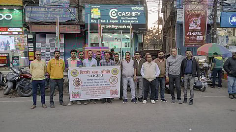 Members of Bihari Seva Samiti protesting with posters in their hands
