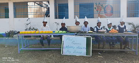 Children standing near a food stall
