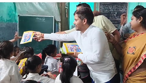 MLA Pawan Singh Distributes Study Material at Kakinada School