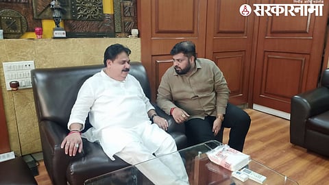 BJP corporator Vikas Mhatre seen in a meeting with Shiv Sena UBT leader Dipesh Mhatre in Dombivli, hinting at political realignment.

