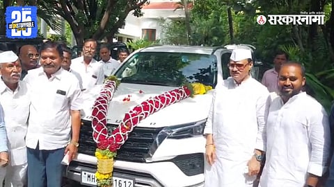 Ajit Pawar during the ceremonial pooja of a new Toyota Fortuner in Baramati, advising the owner to follow all traffic regulations.


