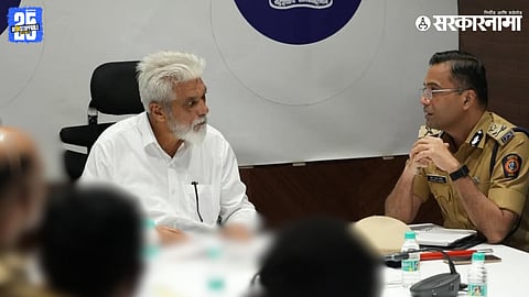 Maharashtra Minister Dada Bhuse giving instructions to Nashik Police Commissioner Sandeep Karnik