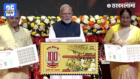 "Prime Minister Narendra Modi releases a special postal stamp on RSS centenary, recalling Jawaharlal Nehru’s invitation for RSS march at Rajpath."
