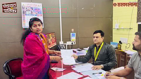 BJP flags outside a Pune election office after a party woman candidate withdrew her nomination following widespread social media backlash during Pune municipal election campaign.