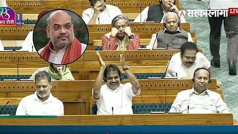 Union Home Minister Amit Shah speaks in the Lok Sabha as Congress leader Rahul Gandhi listens during a heated parliamentary debate.