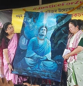 Image of Zubeen Garg's wife and sister presenting the Buddhist inspired portrait of the late music icon